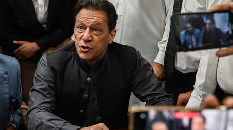 Pakistan's former prime minister, Imran Khan gestures after arriving at a registrar office in Lahore High court to sign surety bonds for bail in various cases, in Lahore on July 3, 2023.