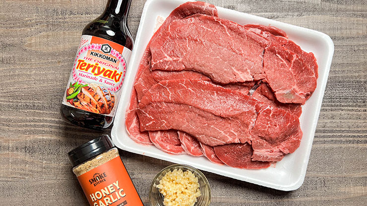 sliced beef top round roast on a styrofoam tray 