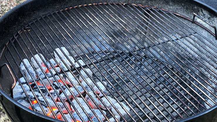 charcoal grill set up with direct and indirect heat zones