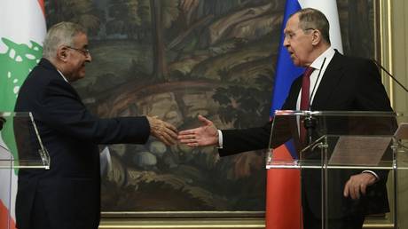 FILE PHOTO: Russian Foreign Minister Sergey Lavrov and his Lebanese counterpart Abdallah Bou Habib shake hands during a news conference in Moscow.