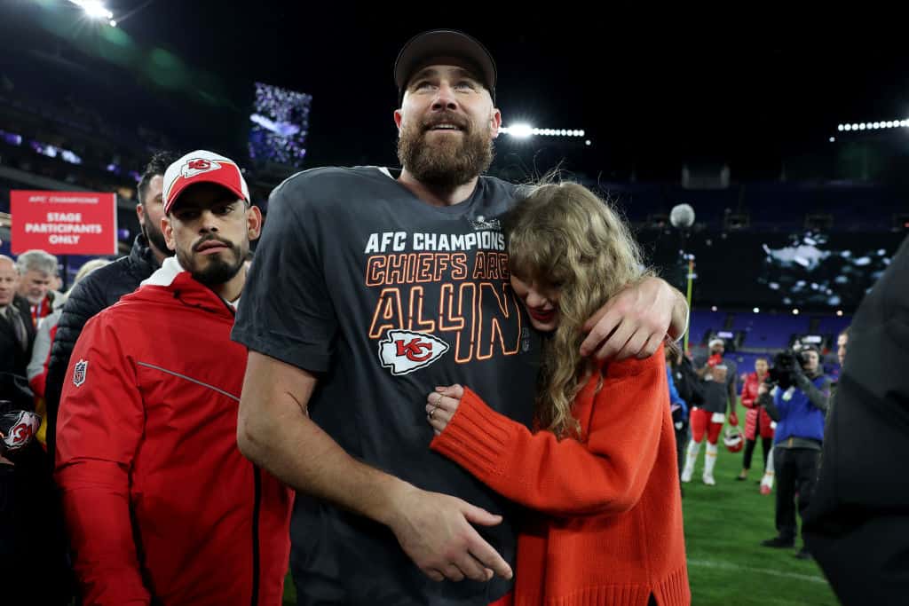 Travis Kelce #87 of the Kansas City Chiefs celebrates with Taylor Swift after a 17-10 victory against the Baltimore Ravens in the AFC Championship Game at M&T Bank Stadium on January 28, 2024 in Baltimore, Maryland.