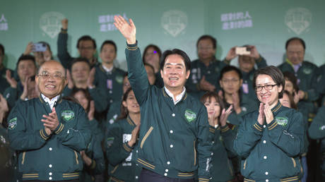 Taiwanese Vice President Lai Ching-te, also known as William Lai, center, celebrates his victory with running mate Bi-khim Hsiao, right, and supporters in Taipei, Taiwan. Jan. 13, 2024.