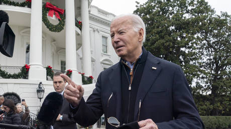 Joe Biden speaks to members of the media as he leaves the White House in Washington DC, December 23, 2023