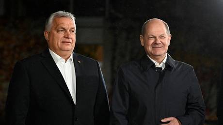 German Chancellor Olaf Scholz (R) poses with Hungarian Prime Minister Viktor Orban at the Chancellery in Berlin, Germany, November 13, 2023