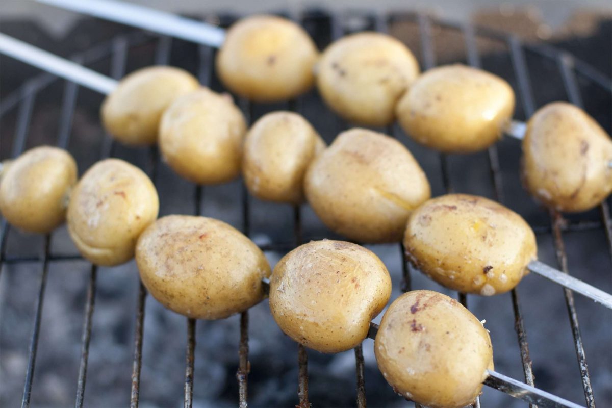 skewered baby potatoes on the grill