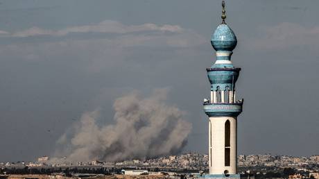 Smoke billowing during Israeli bombardment over Khan Yunis in Gaza, February 10, 2024.