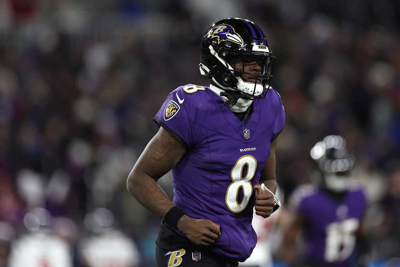 BALTIMORE, MARYLAND - JANUARY 20: Quarterback Lamar Jackson #8 of the Baltimore Ravens reacts against the Houston Texans during the second quarter in the AFC Divisional Playoff game at M&T Bank Stadium on January 20, 2024 in Baltimore, Maryland.