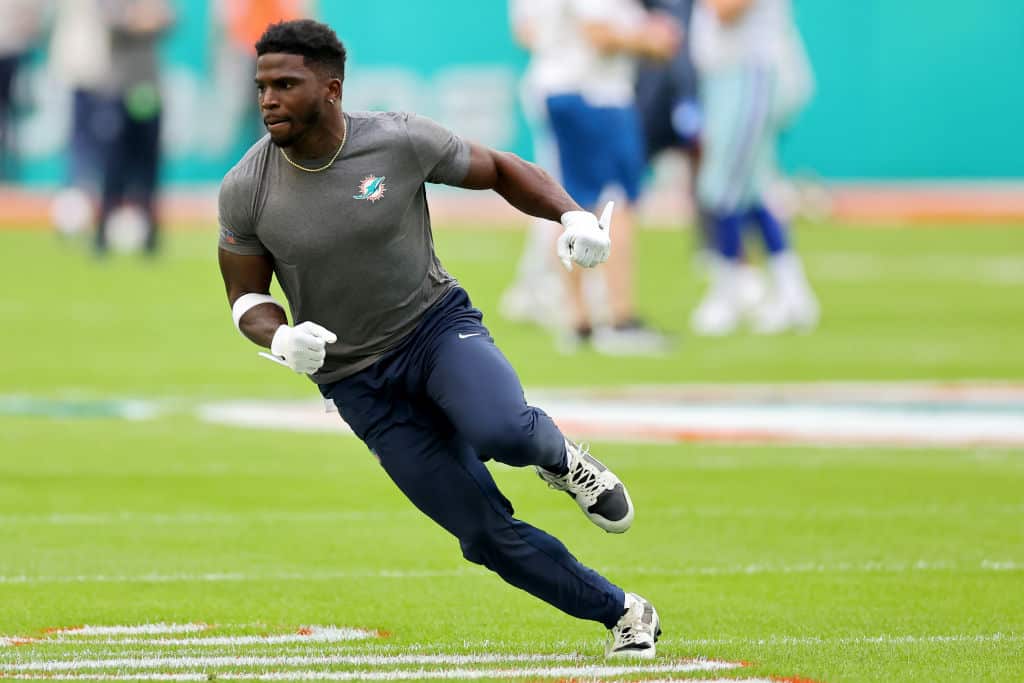 Tyreek Hill #10 of the Miami Dolphins warms up prior to the game against the Dallas Cowboys at Hard Rock Stadium on December 24, 2023 in Miami Gardens, Florida.