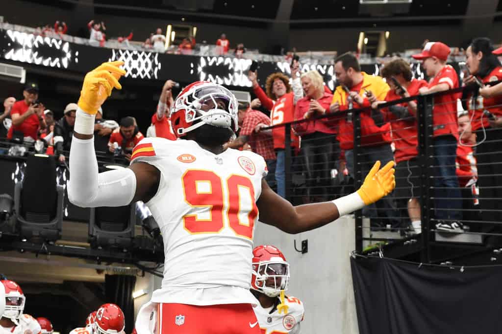 Defensive end Charles Omenihu #90 of the Kansas City Chiefs runs out onto the field before the game against the Las Vegas Raiders at Allegiant Stadium on November 26, 2023 in Las Vegas, Nevada. The Chiefs defeated the Raiders 31-17. 