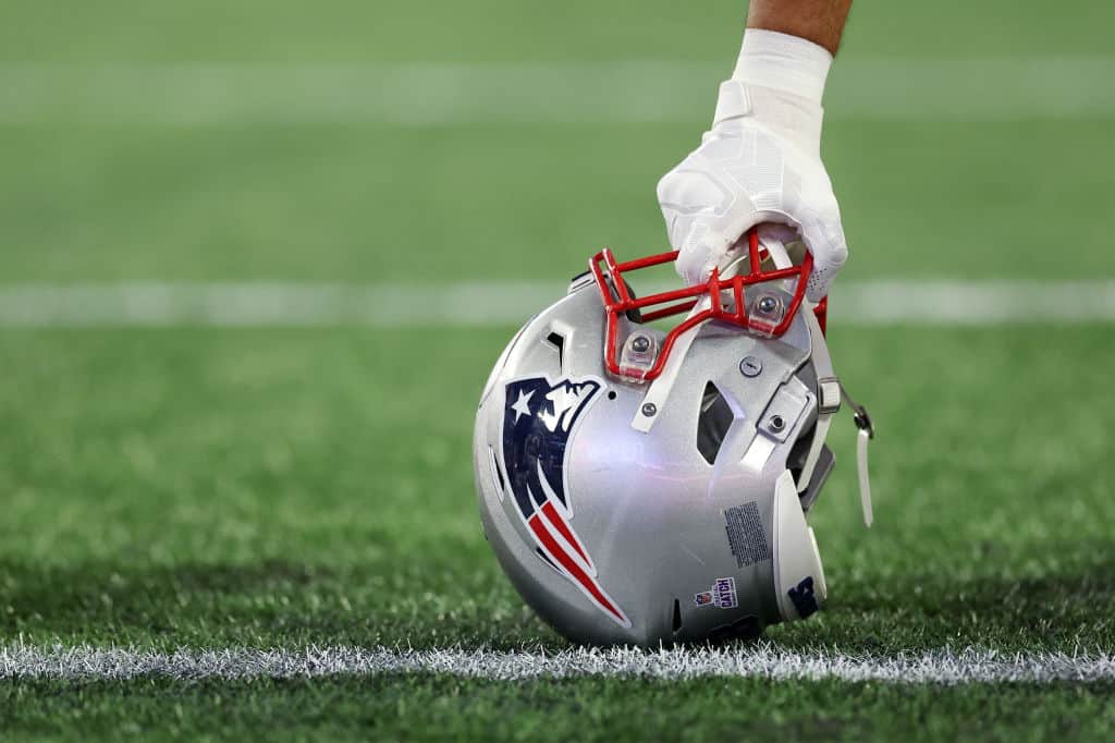 A detail as a New England Patriots player holds a helmet before the game between the Chicago Bears and the New England Patriots at Gillette Stadium on October 24, 2022 in Foxborough, Massachusetts.