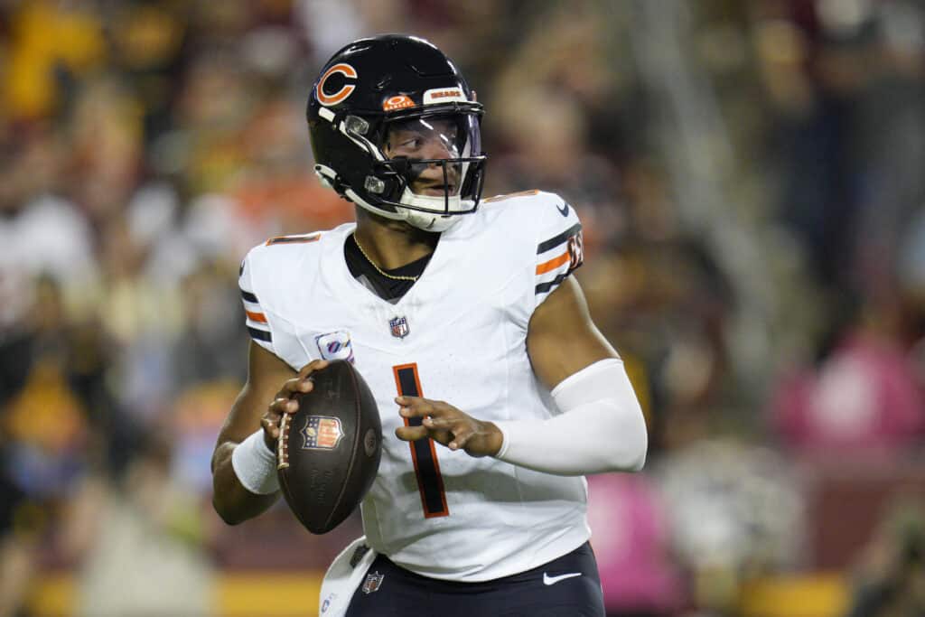 Justin Fields #1 of the Chicago Bears looks to pass during the first half against the Washington Commanders at FedExField on October 05, 2023 in Landover, Maryland.