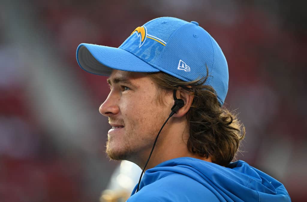 Justin Herbert #10 of the Los Angeles Chargers looks on from the sideline during the first half of a preseason game against the San Francisco 49ers at Levi's Stadium on August 25, 2023 in Santa Clara, California.