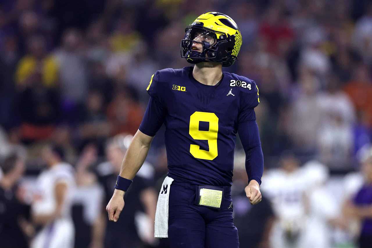 HOUSTON, TEXAS - JANUARY 08: J.J. McCarthy #9 of the Michigan Wolverines looks on in the first half against the Washington Huskies during the 2024 CFP National Championship game at NRG Stadium on January 08, 2024 in Houston, Texas.