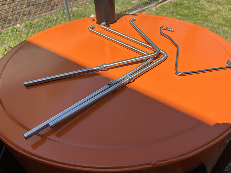 metal hooks on top of Oklahoma Joe Bronco Pro drum smoker