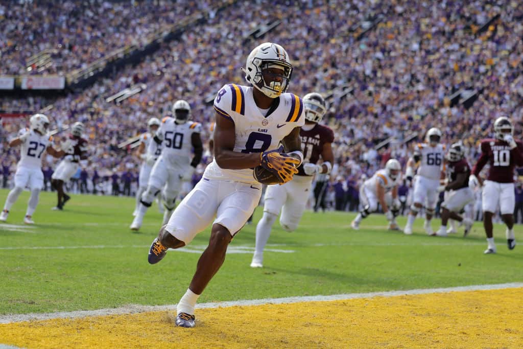 Malik Nabers #8 of the LSU Tigers scores a touchdown during the first half against the Texas A&M Aggies at Tiger Stadium on November 25, 2023 in Baton Rouge, Louisiana. 