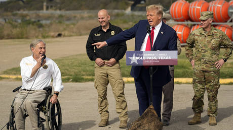 Donald Trump points to Texas Governor Greg Abbott as he speaks in Eagle Pass, Texas, February 29, 2024