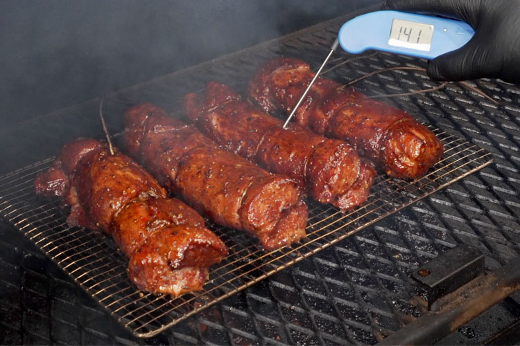 pork tenderloin with a thermometer probe in it