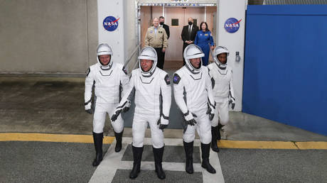 Crew-8 (L-R) Russian cosmonaut and Mission Specialist Alexander Grebenkin, Pilot Michael Barratt, Commander Matthew Dominick, and Mission Specialist Jeanette Epps are on their way to the SpaceX Falcon 9 rocket on March 3, 2024.