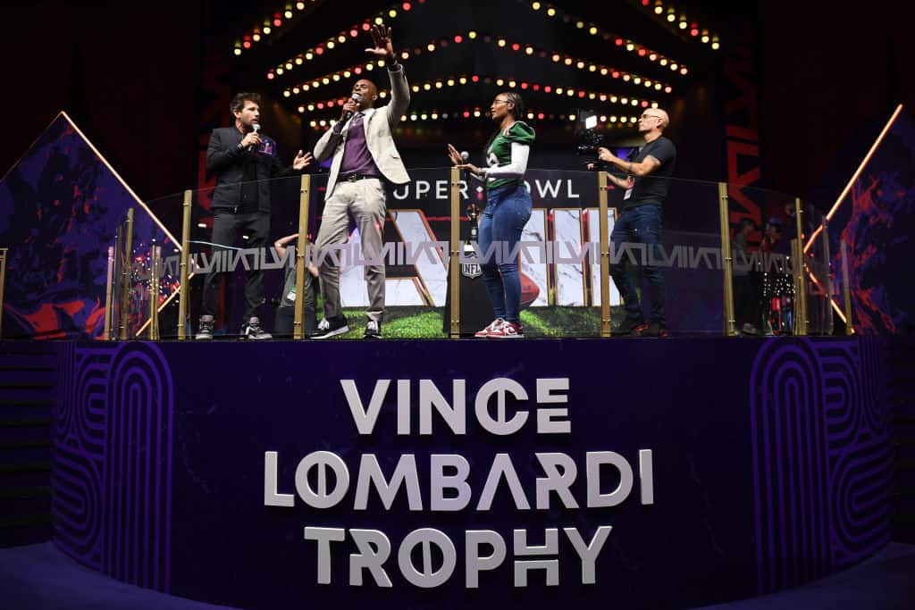 Former NFL player Jerry Rice greets the fans after delivering the Vince Lombardi Trophy from a FedEx truck to its place inside Super Bowl Experience at the Mandalay Bay Convention Center on February 07, 2024 in Las Vegas, Nevada.