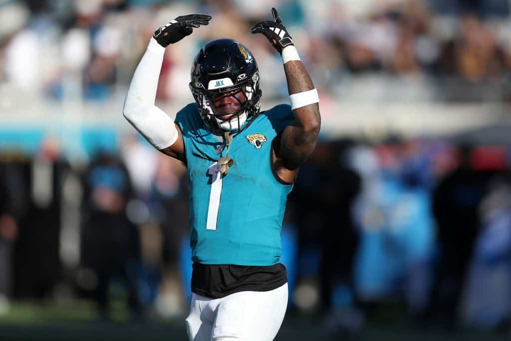 Travis Etienne Jr. #1 of the Jacksonville Jaguars celebrates after a rushing touchdown during the fourth quarter against the Carolina Panthers at EverBank Stadium on December 31, 2023 in Jacksonville, Florida.