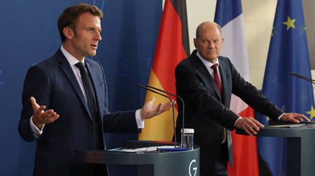 FILE PHOTO: French President Emmanuel Macron and German Chancellor Olaf Scholz.