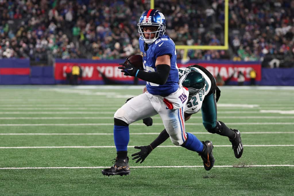 Saquon Barkley #26 of the New York Giants scores a touchdown during the second quarter in the game against the Philadelphia Eagles at MetLife Stadium on January 07, 2024 in East Rutherford, New Jersey.