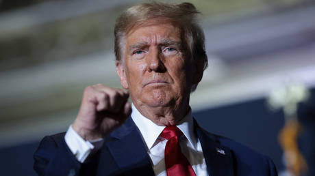 Republican presidential candidate, former US President Donald Trump gestures to supporters after speaking at a rally in North Charleston, South Carolina, on February 14, 2024.