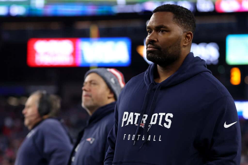 FOXBOROUGH, MASSACHUSETTS - DECEMBER 17: New England Patriots linebackers coach Jerod Mayo looks on from the sideline next to head coach Bill Belichik during the game against the Kansas City Chiefs at Gillette Stadium on December 17, 2023 in Foxborough, Massachusetts.