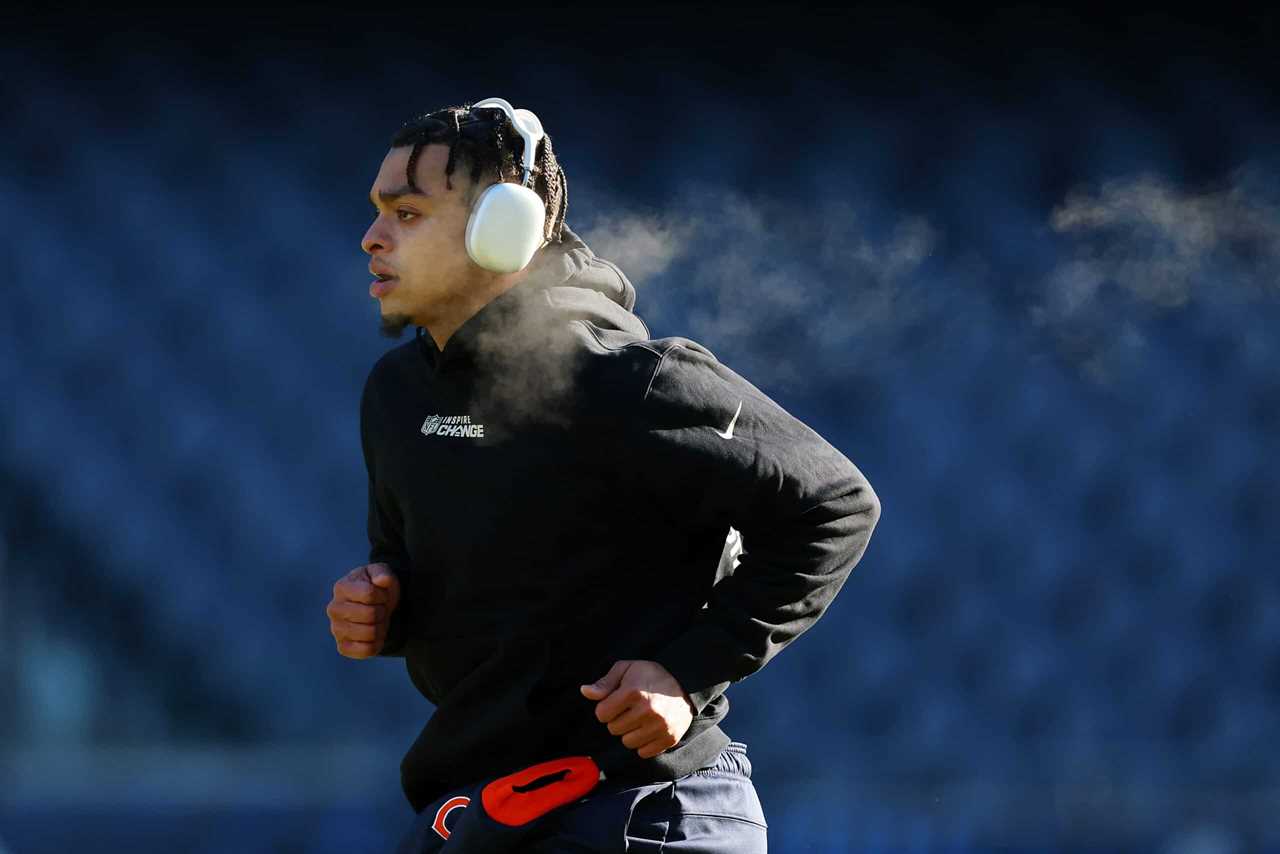 Justin Fields #1 of the Chicago Bears warms up prior to the game against the Philadelphia Eagles at Soldier Field on December 18, 2022 in Chicago, Illinois.