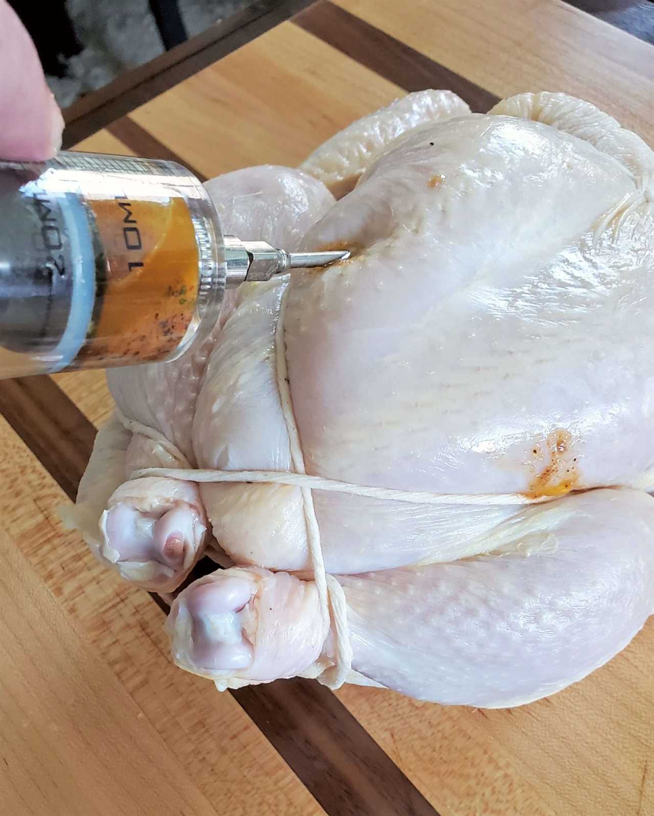 Injecting a Chicken with marinade