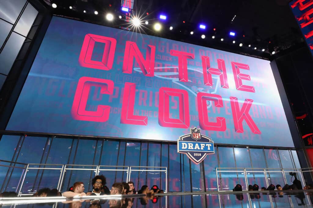 ARLINGTON, TX - APRIL 26: A video board displays the text "ON THE CLOCK" for the New England Patriots during the first round of the 2018 NFL Draft at AT&T Stadium on April 26, 2018 in Arlington, Texas.