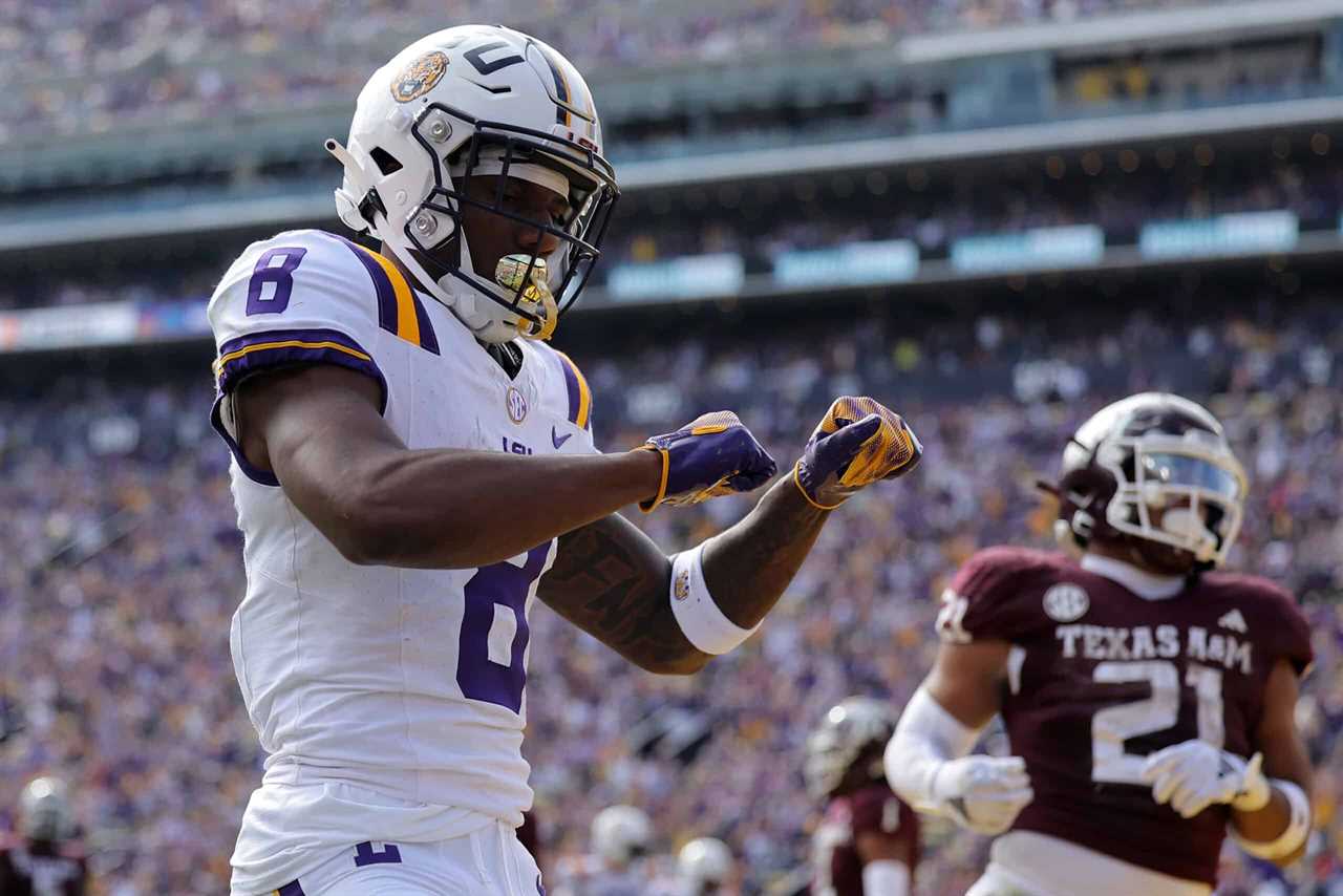 BATON ROUGE, LOUISIANA - NOVEMBER 25: Malik Nabers #8 of the LSU Tigers celebrates a touchdown during the first half against the Texas A&M Aggies at Tiger Stadium on November 25, 2023 in Baton Rouge, Louisiana.