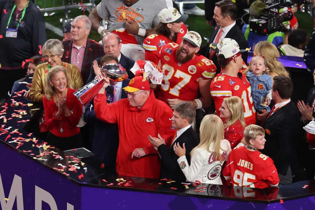 LAS VEGAS, NEVADA - FEBRUARY 11: Head coach Andy Reid of the Kansas City Chiefs holds the Lombardi Trophy after defeating the San Francisco 49ers 25-22 in overtime during Super Bowl LVIII at Allegiant Stadium on February 11, 2024 in Las Vegas, Nevada