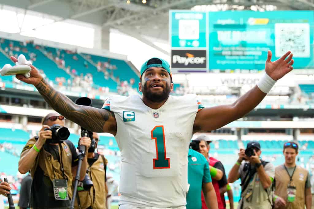 Tua Tagovailoa #1 of the Miami Dolphins reacts after his team's 31-17 win against the New England Patriots at Hard Rock Stadium on October 29, 2023 in Miami Gardens, Florida.