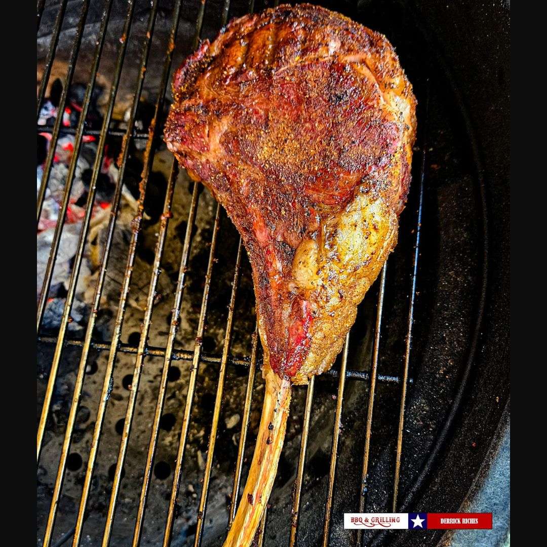 tomahawk on charcoal grill-steak