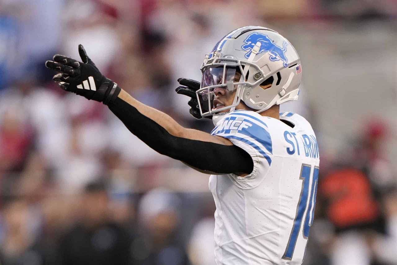 SANTA CLARA, CALIFORNIA - JANUARY 28: Amon-Ra St. Brown #14 of the Detroit Lions reacts after catching a pass for a first down during the second quarter against the San Francisco 49ers in the NFC Championship Game at Levi's Stadium on January 28, 2024 in Santa Clara, California.