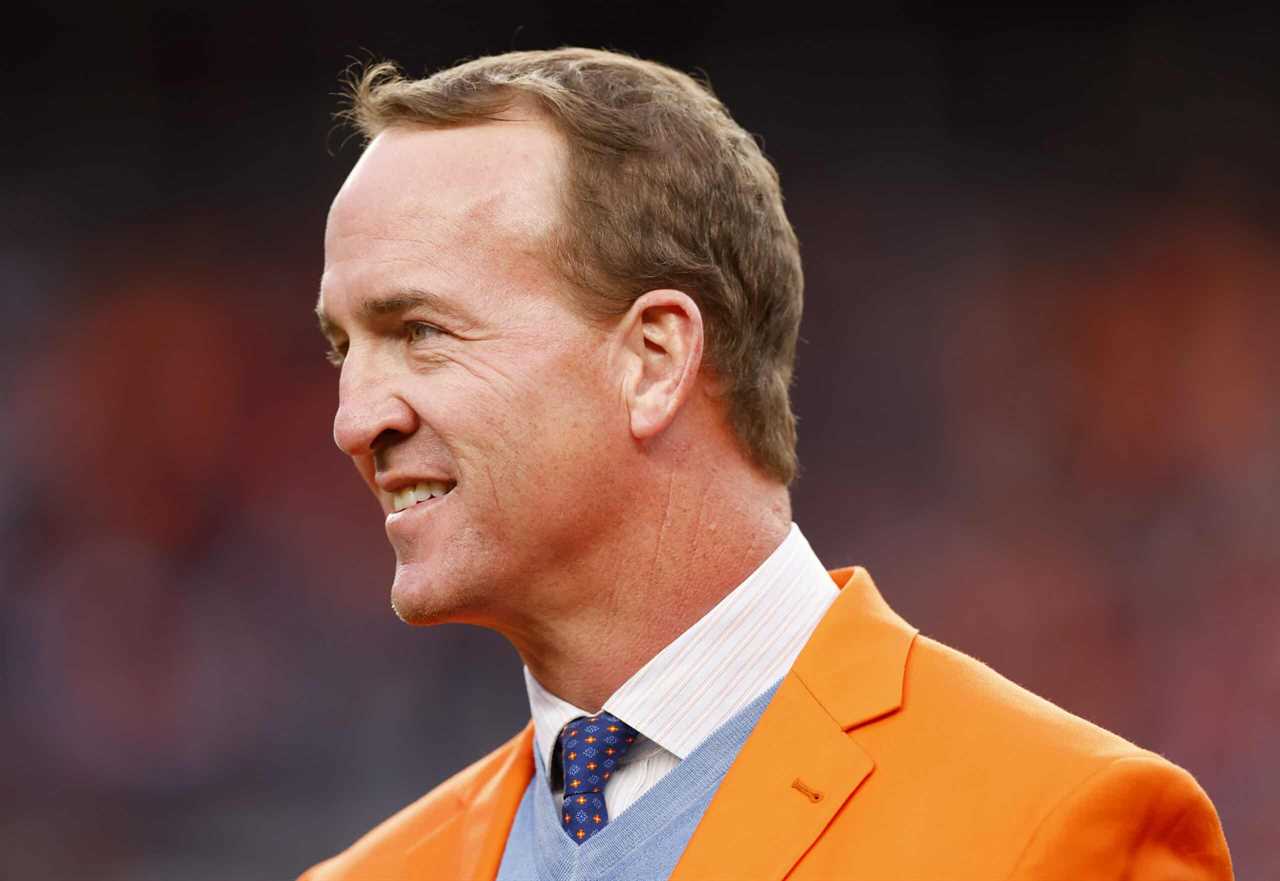 Peyton Manning looks on during a Ring of Honor induction ceremony at halftime of the game between the Washington Football Team and Denver Broncos at Empower Field At Mile High on October 31, 2021 in Denver, Colorado.