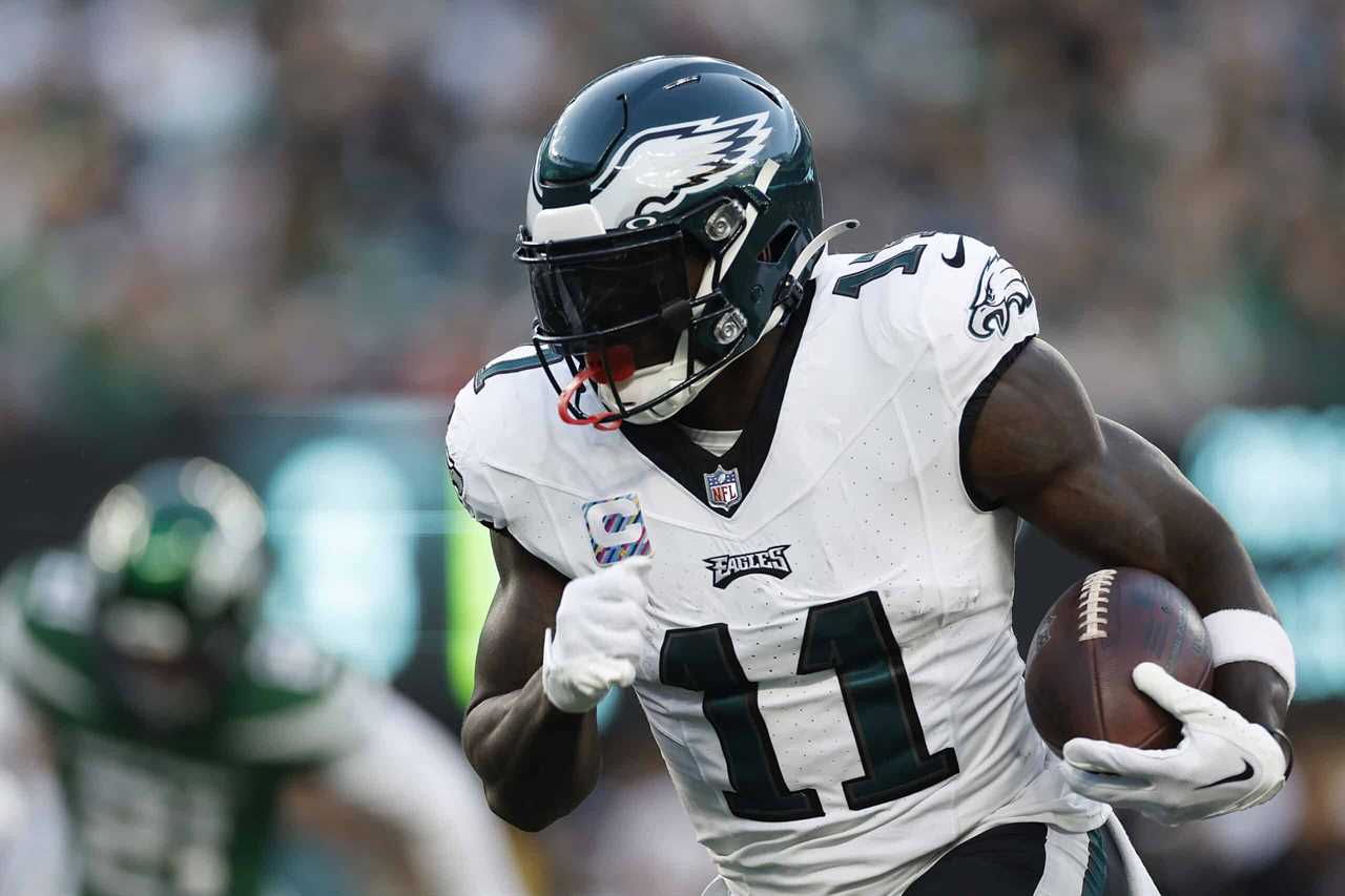 A.J. Brown #11 of the Philadelphia Eagles runs the ball during the first half in the game against the New York Jets at MetLife Stadium on October 15, 2023 in East Rutherford, New Jersey.