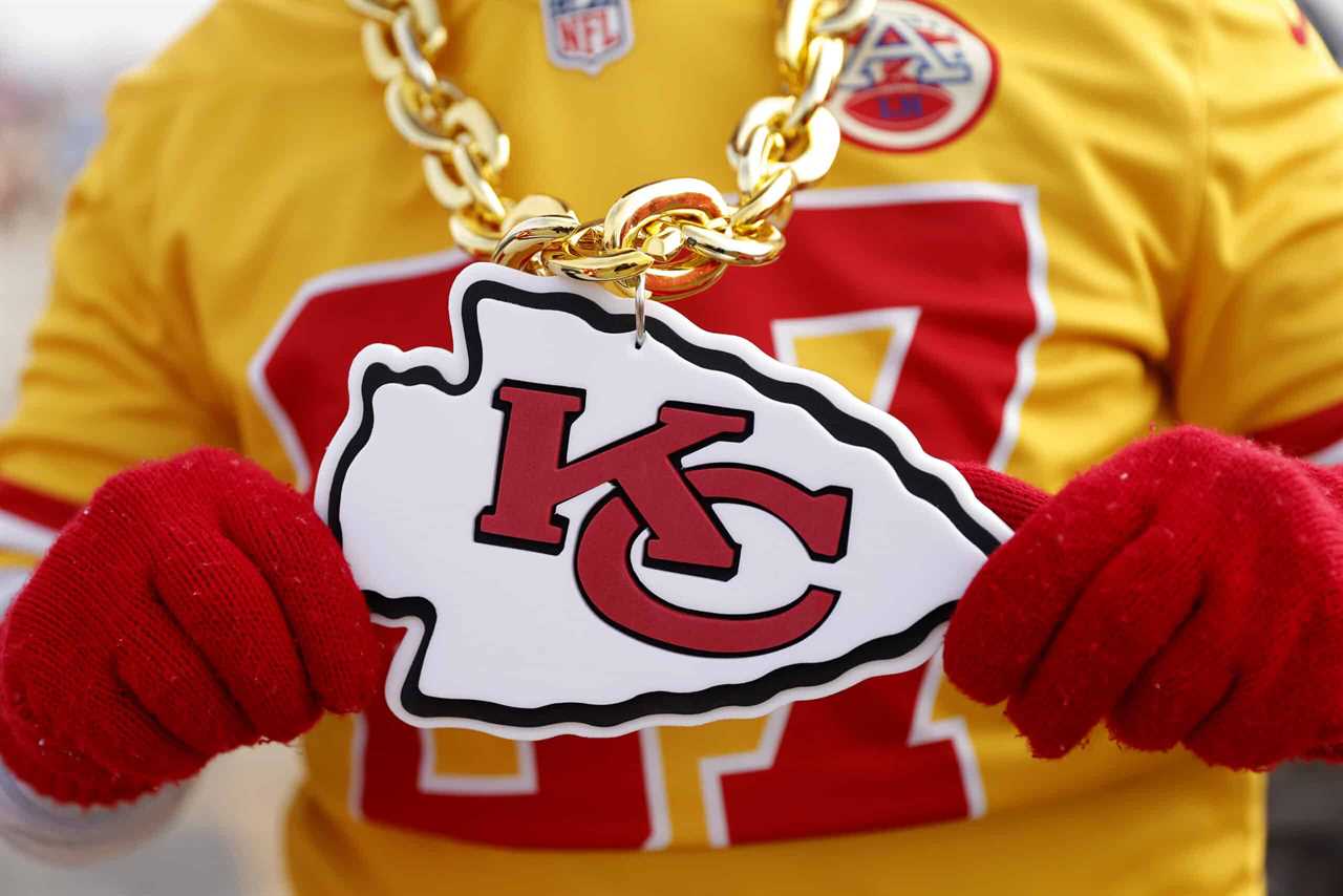 KANSAS CITY, MISSOURI - JANUARY 29: A detailed view of the Kansas City Chiefs logo on a fan prior to the AFC Championship Game against the Cincinnati Bengals at GEHA Field at Arrowhead Stadium on January 29, 2023 in Kansas City, Missouri.