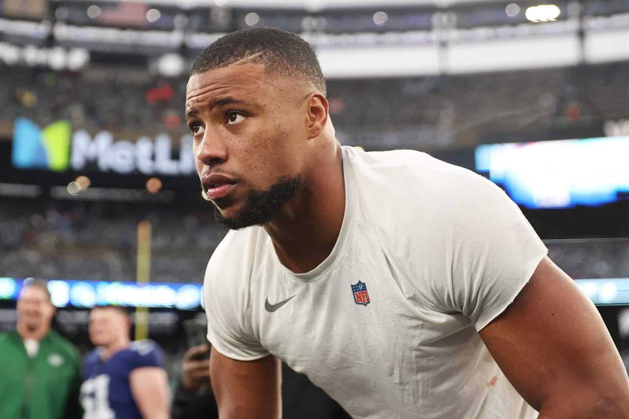 EAST RUTHERFORD, NEW JERSEY - OCTOBER 29: Saquon Barkley #26 of the New York Giants looks on after his team's 13-10 overtime loss against the New York Jets at MetLife Stadium on October 29, 2023 in East Rutherford, New Jersey.