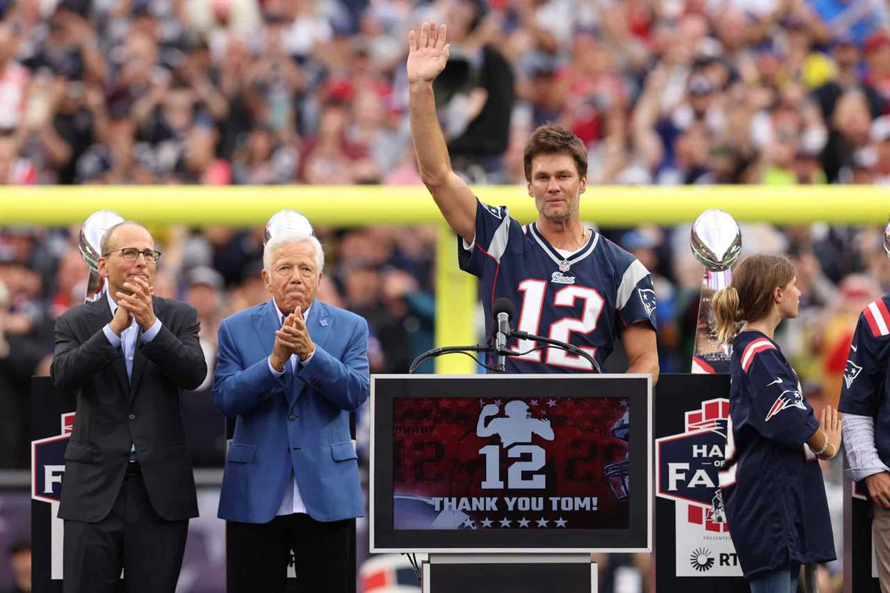 New England Patriots President Jonathan Kraft, New England Patriots owner Robert Kraft clap as former New England Patriots quarterback Tom Brady celebrates during a ceremony honoring Brady at halftime of New England's game against the Philadelphia Eagles at Gillette Stadium on September 10, 2023 in Foxborough, Massachusetts.