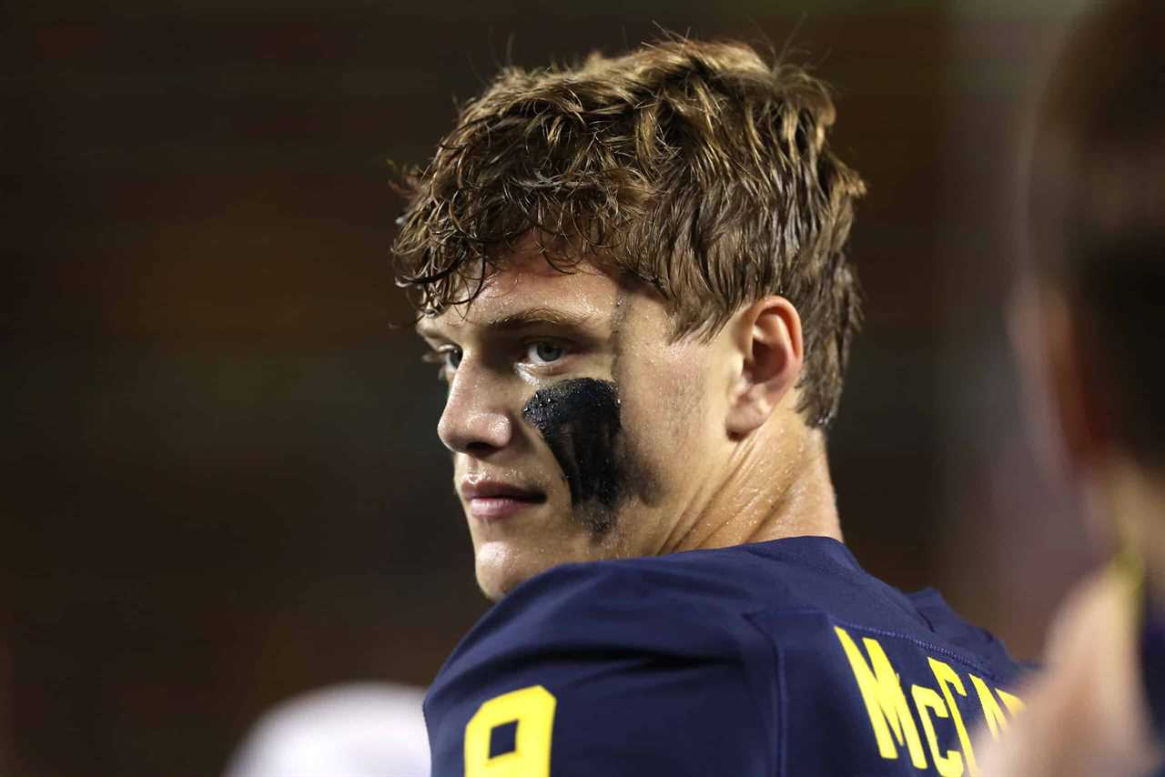 ANN ARBOR, MICHIGAN - SEPTEMBER 10: J.J. McCarthy #9 of the Michigan Wolverines looks on from the sidelines while playing the Hawaii Warriors at Michigan Stadium on September 10, 2022 in Ann Arbor, Michigan.