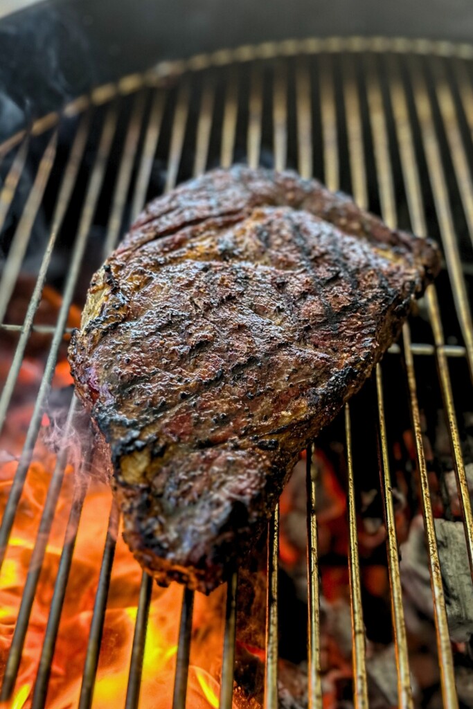 ribeye steak on a charcoal grill