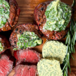 sliced steak with herb compound butter