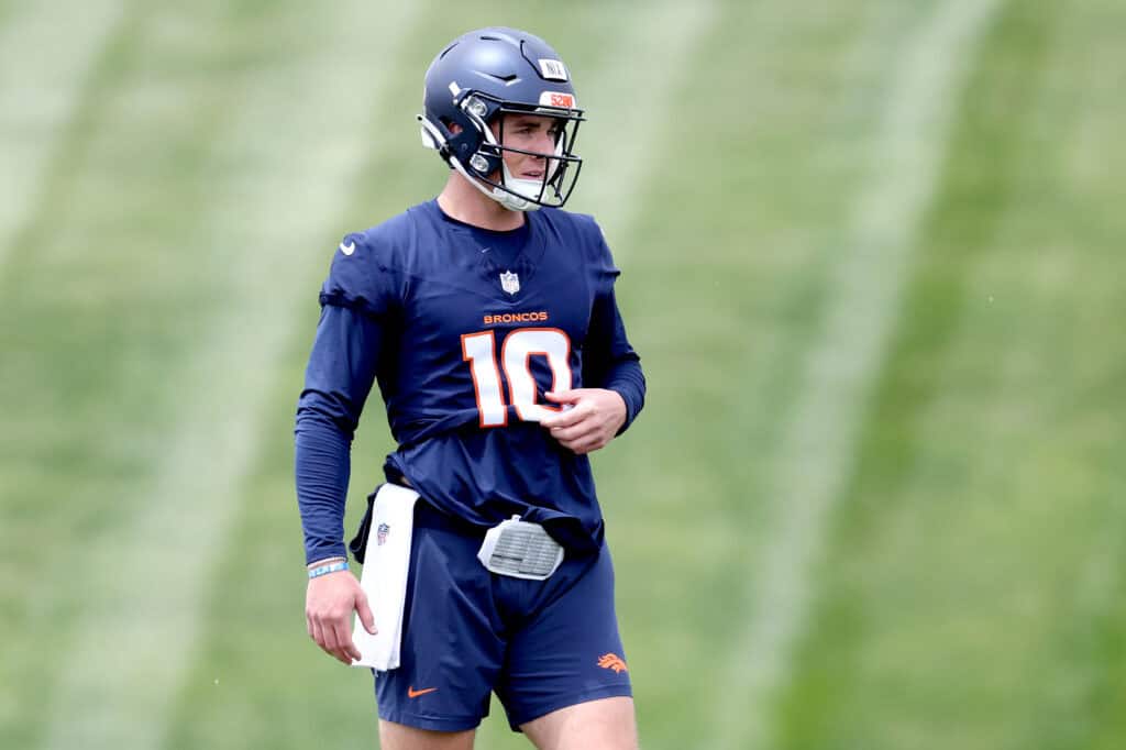 ENGLEWOOD, COLORADO - MAY 11: Quarterback Bo Nix #10 of the Denver Broncos walks on the field during Denver Broncos Rookie Minicamp at Centura Health Training Center on May 11, 2024 in Englewood, Colorado. 