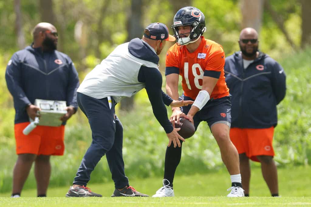 Caleb Williams #18 of the Chicago Bears takes part in a drill during Chicago Bears Rookie Minicamp at Halas Hall on May 11, 2024 in Lake Forest, Illinois.