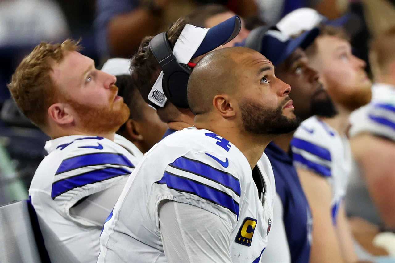 ARLINGTON, TEXAS - JANUARY 14: Dak Prescott #4 of the Dallas Cowboys looks on from the bench during the NFC Wild Card Playoff game against the Green Bay Packers at AT&T Stadium on January 14, 2024 in Arlington, Texas.