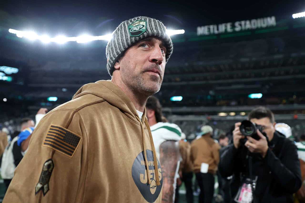 Aaron Rodgers #8 of the New York Jets reacts on the field after the Los Angeles Chargers defeated the New York Jets 27-6 at MetLife Stadium on November 06, 2023 in East Rutherford, New Jersey.