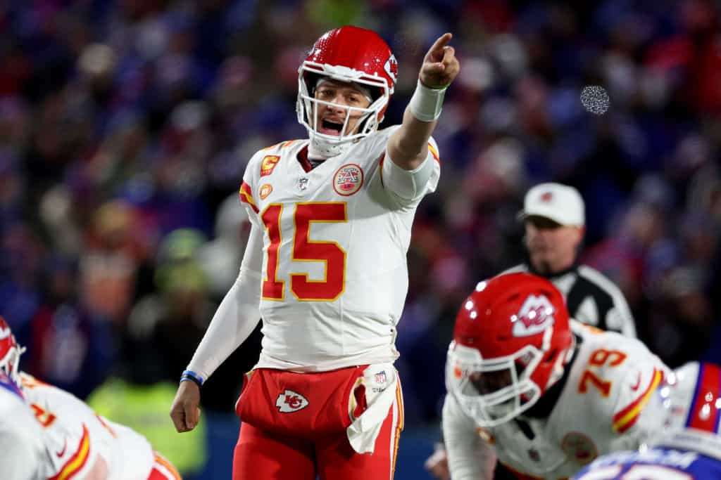 Patrick Mahomes #15 of the Kansas City Chiefs points against the Buffalo Bills during the second quarter in the AFC Divisional Playoff game at Highmark Stadium on January 21, 2024 in Orchard Park, New York.