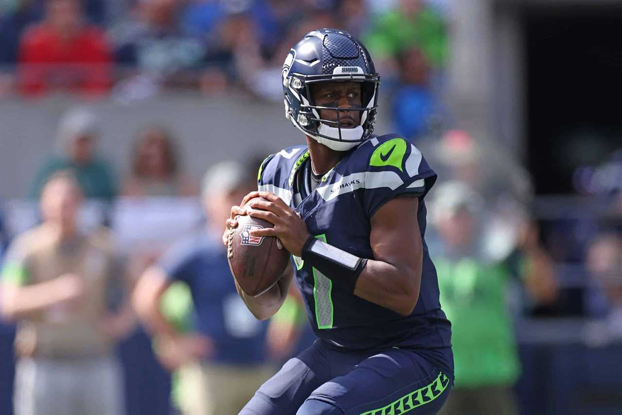 Geno Smith #7 of the Seattle Seahawks attempts a pass against the Los Angeles Rams during the first half at Lumen Field on September 10, 2023 in Seattle, Washington.